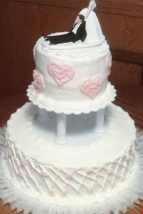 Wedding Cake with Bride dragging Groom