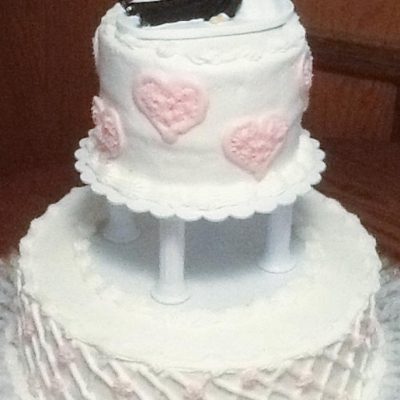 Wedding Cake with Bride dragging Groom